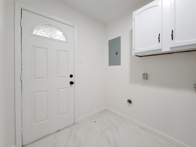 laundry room featuring cabinets, hookup for an electric dryer, and electric panel