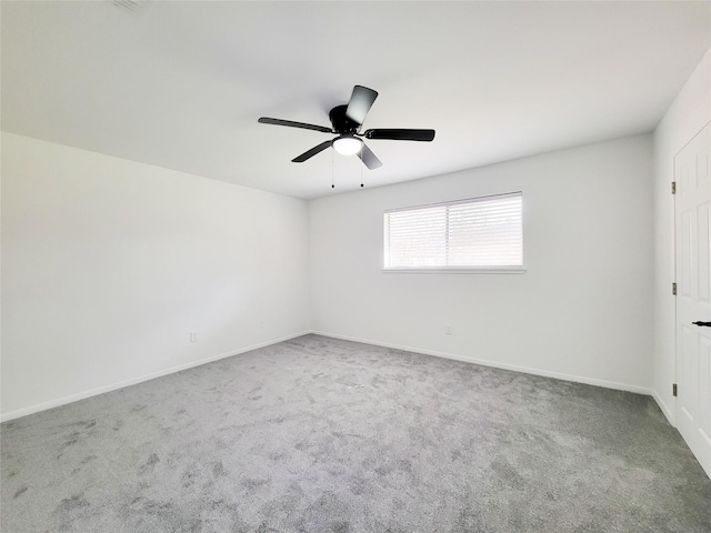 unfurnished room with carpet and ceiling fan