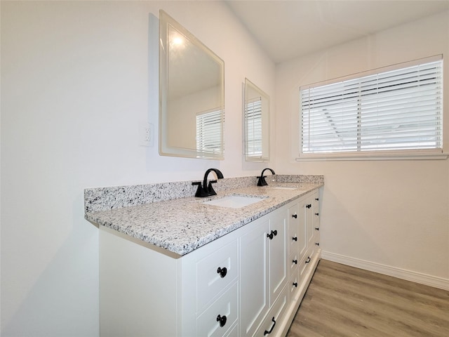 bathroom featuring vanity and hardwood / wood-style floors