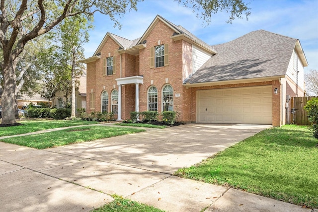 front of property with a garage and a front yard