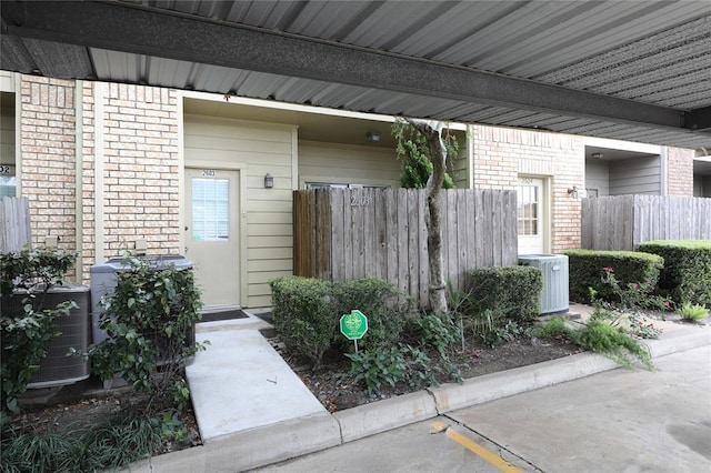 entrance to property featuring cooling unit