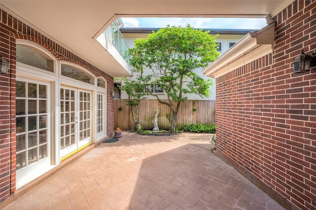 view of patio / terrace with french doors and fence