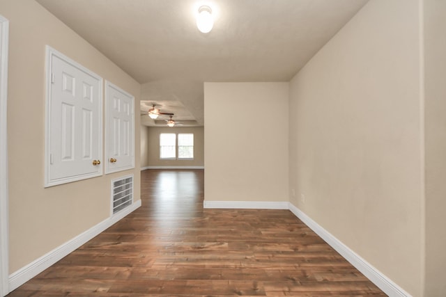 corridor featuring dark hardwood / wood-style floors