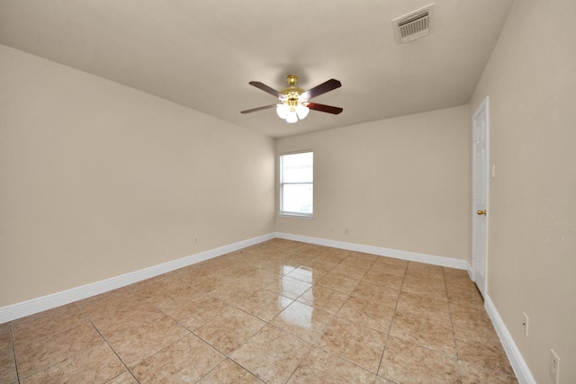 unfurnished room featuring light tile patterned floors and ceiling fan