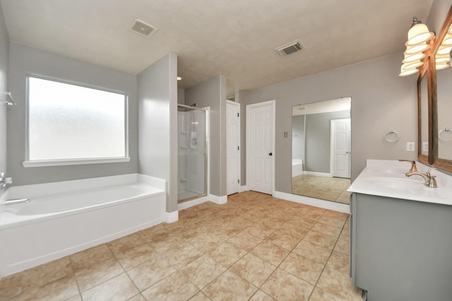 bathroom with vanity, separate shower and tub, and tile patterned floors