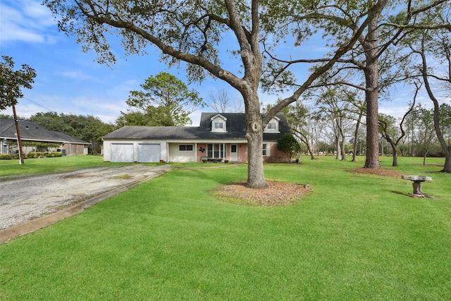 view of front of house featuring a garage and a front yard