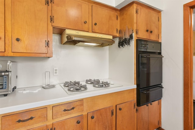 kitchen featuring white gas stovetop and oven