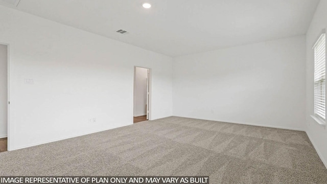 spare room with carpet flooring