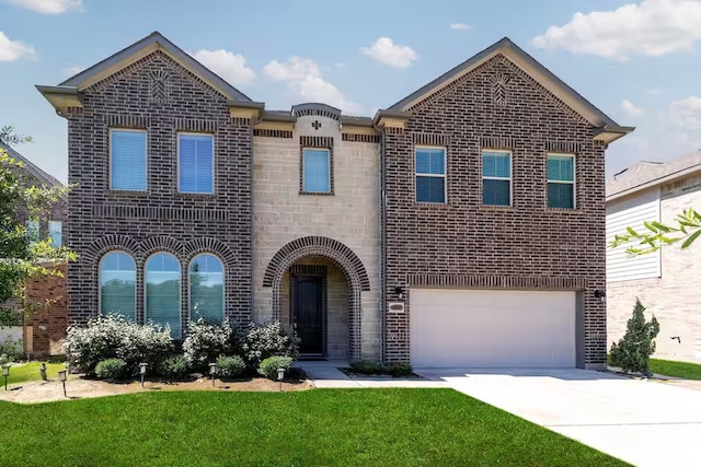 view of front facade with a garage and a front yard