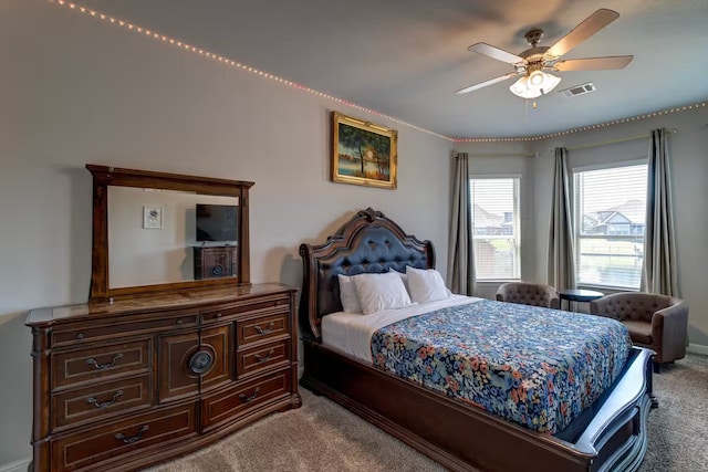 bedroom with light carpet and ceiling fan