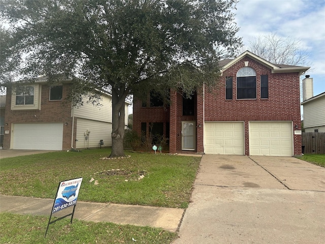 view of front of home with a garage and a front yard