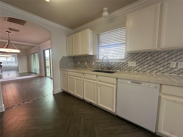 kitchen with pendant lighting, dark parquet floors, dishwasher, sink, and ornamental molding