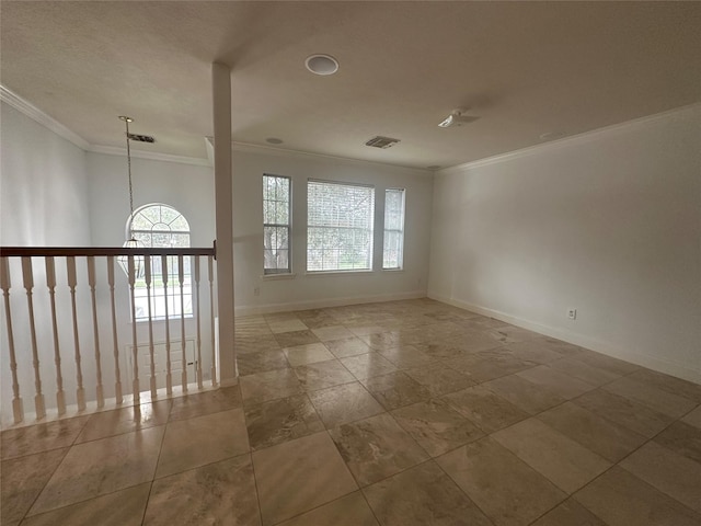 empty room featuring ornamental molding and a wealth of natural light