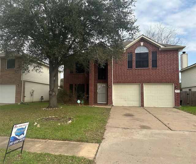 view of front of home featuring a garage and a front lawn