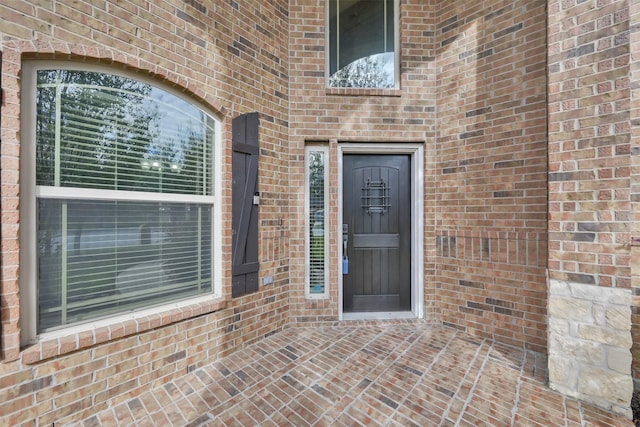 entrance to property with a patio area