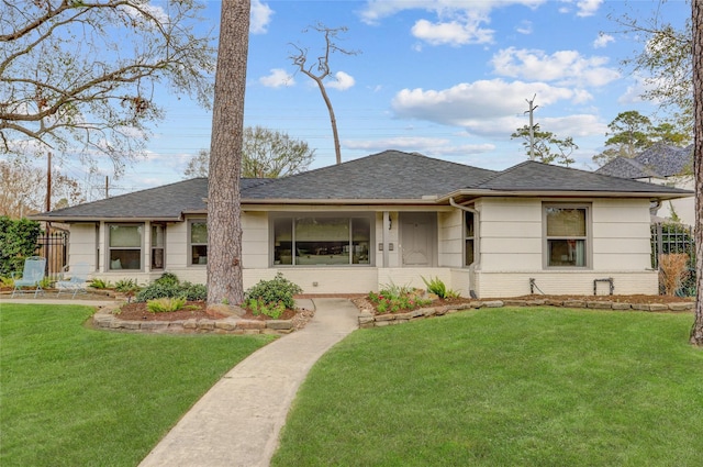 view of front of property with a front lawn