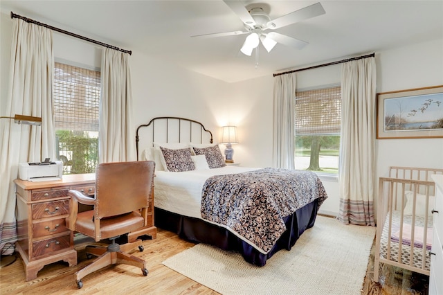 bedroom featuring wood-type flooring and ceiling fan