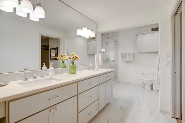 bathroom featuring vanity, toilet, and an enclosed shower