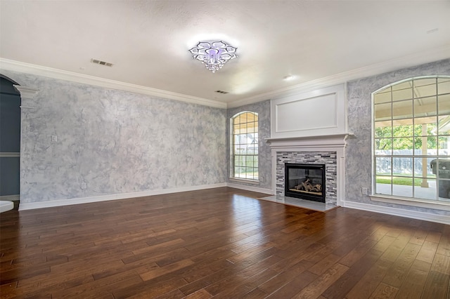 unfurnished living room featuring dark wood-type flooring and ornamental molding