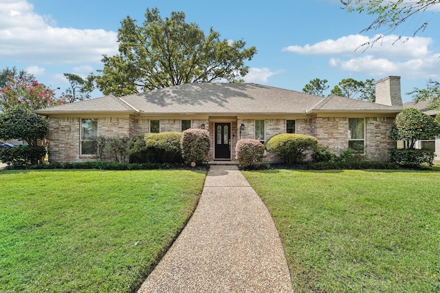 single story home featuring a front yard