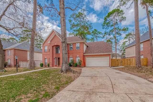 view of front of property with a garage and a front yard