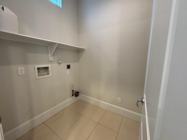 laundry area with gas dryer hookup, hookup for an electric dryer, light tile patterned flooring, and hookup for a washing machine