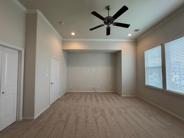 interior space with ceiling fan and ornamental molding