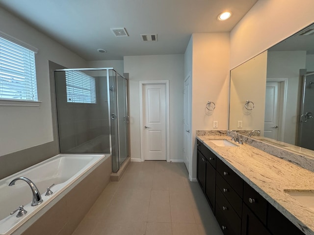 bathroom featuring vanity, tile patterned flooring, and shower with separate bathtub