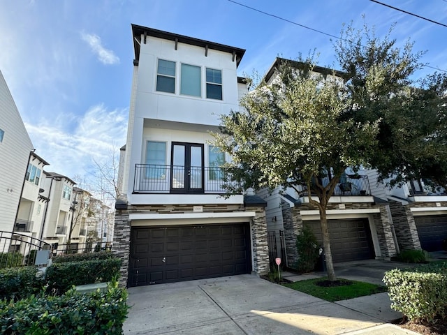 view of front of house featuring a balcony and a garage