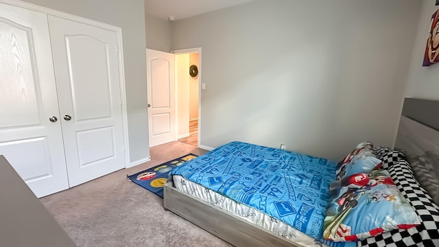 bedroom featuring a closet and carpet flooring