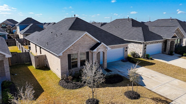 view of front facade featuring a garage and a front yard