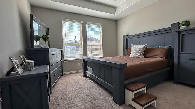 bedroom with light colored carpet