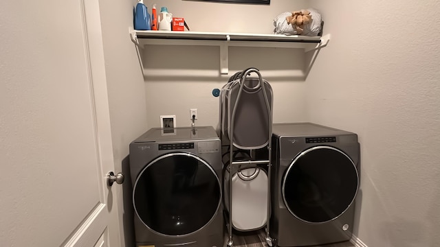 clothes washing area with independent washer and dryer