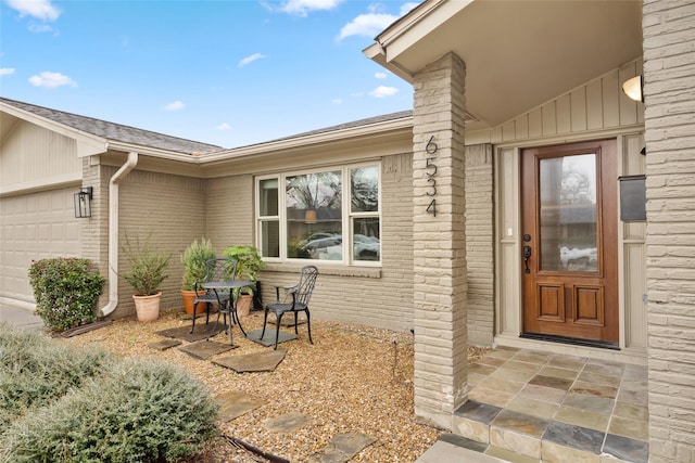 entrance to property featuring a garage