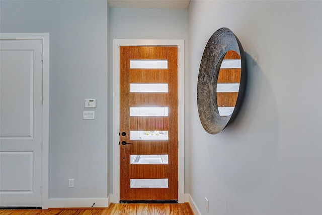 foyer entrance with light wood-type flooring