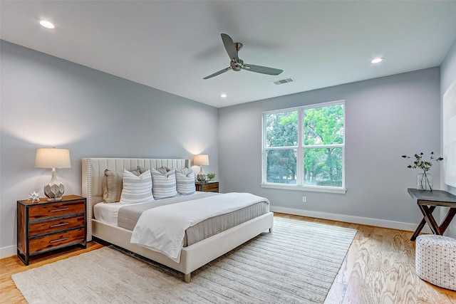 bedroom with ceiling fan and light wood-type flooring