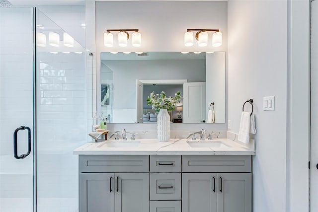 bathroom featuring an enclosed shower and vanity