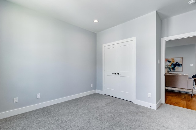 carpeted bedroom featuring a closet