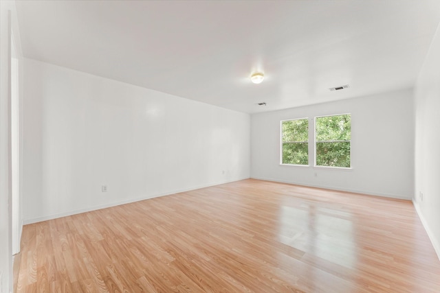 spare room featuring light hardwood / wood-style flooring