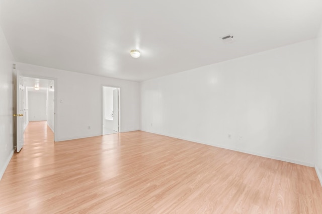 unfurnished room with light hardwood / wood-style flooring