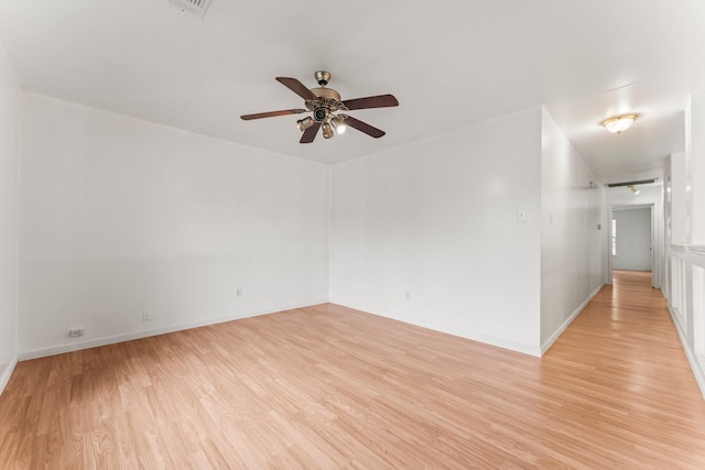 unfurnished room featuring ceiling fan and light hardwood / wood-style floors