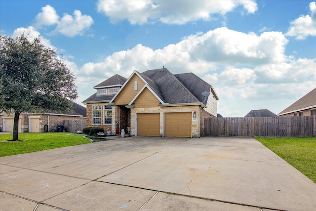 view of front of property with a garage and a front yard