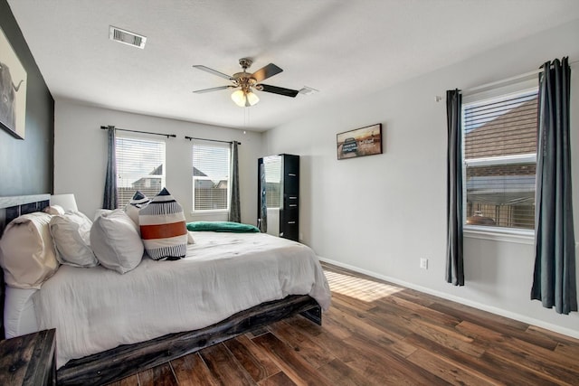 bedroom featuring dark hardwood / wood-style flooring and ceiling fan