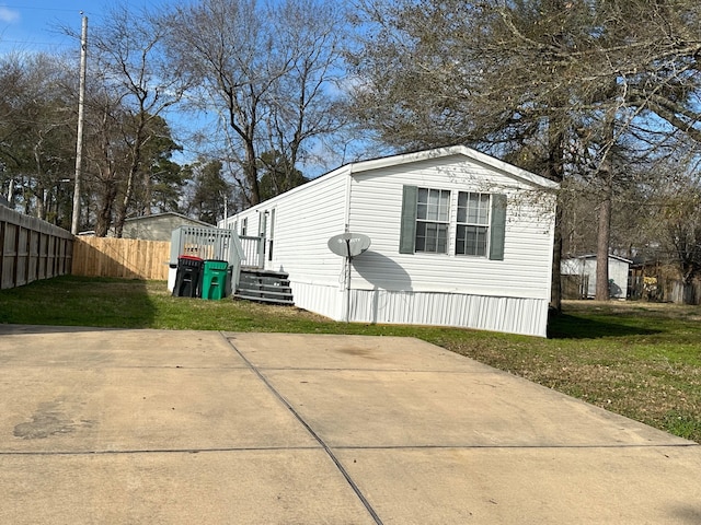 view of property exterior with a lawn