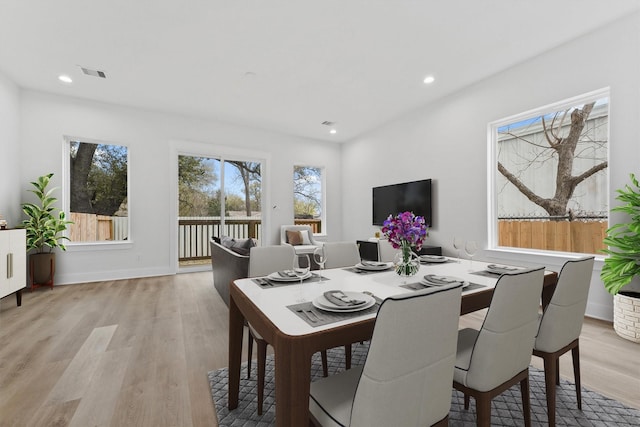 dining area with light wood-type flooring