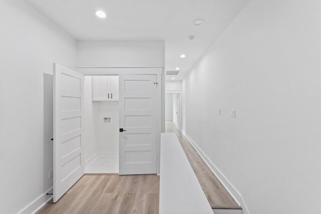 hallway with light wood-type flooring