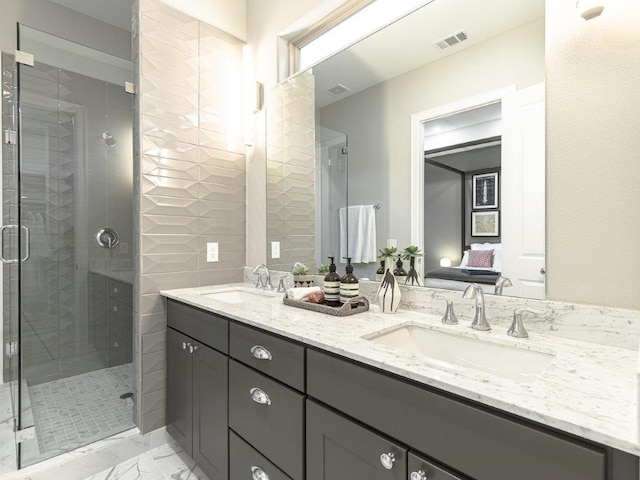 bathroom featuring vanity and an enclosed shower