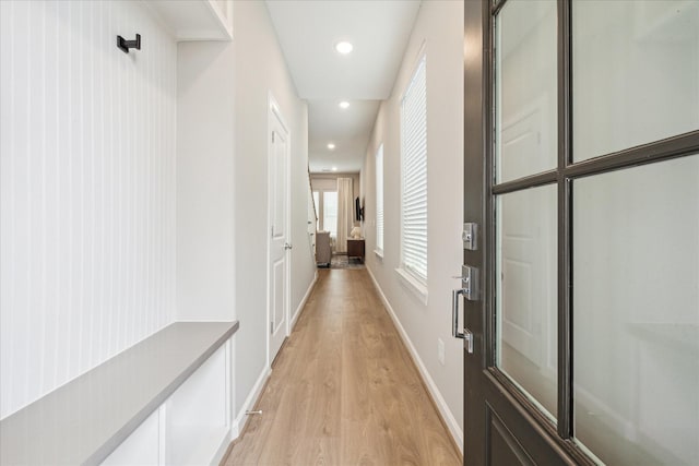 corridor with light wood-type flooring