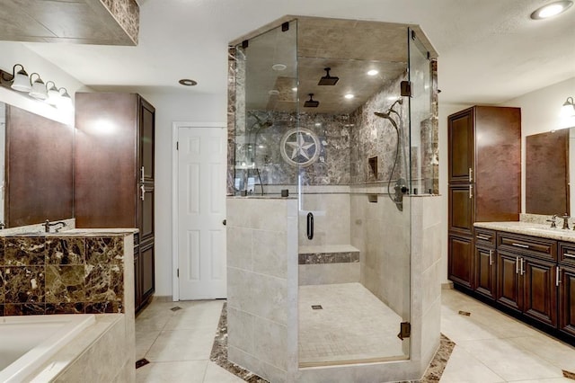 bathroom with vanity, tile patterned floors, and separate shower and tub