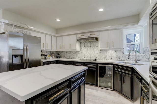 kitchen with wine cooler, sink, stainless steel fridge with ice dispenser, light stone countertops, and white cabinets